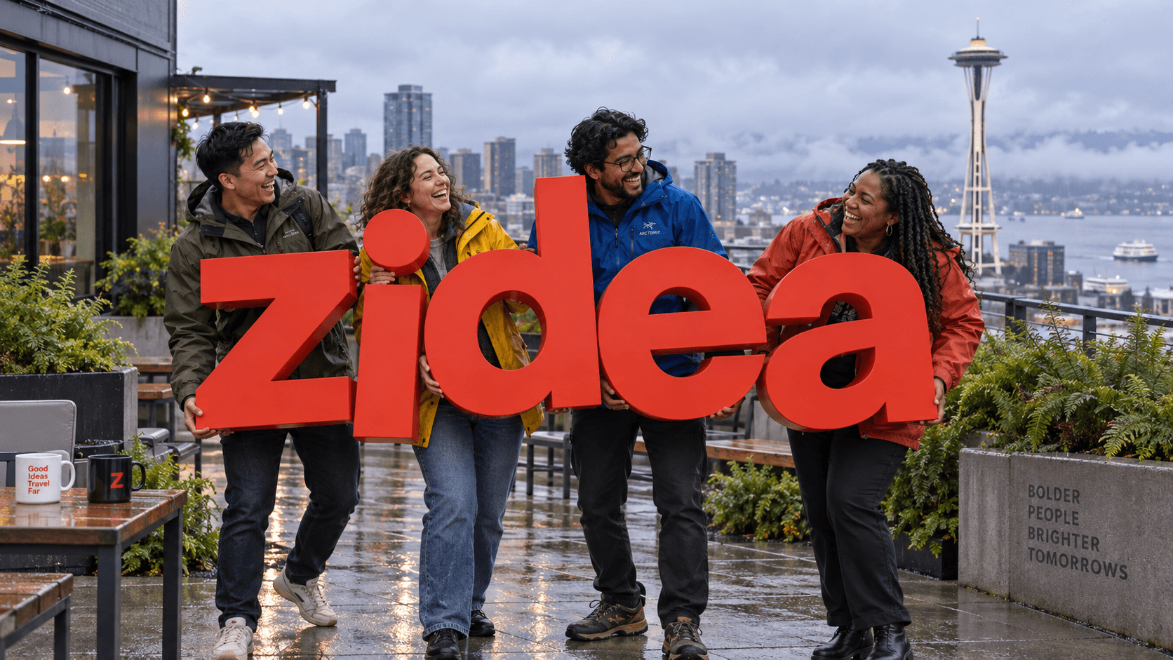 AI-generated fictional office photograph. A small team holds orange zidea letters on a rainy Seattle rooftop overlooking the Space Needle.